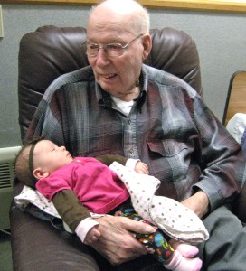 Grandpa Snuggling Kamea his first Great Granddaughter.